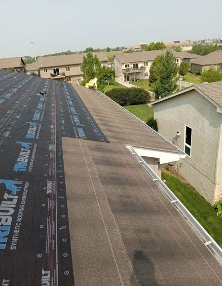 Roof installation in Omaha, featuring synthetic roofing materials on a residential home, showcasing a worry-free exterior upgrade.