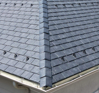 Residential roofing installation showcasing quality slate shingles, emphasizing durability and protection for homes against the elements.